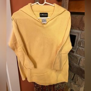 V neck sweater with longer flat collar.